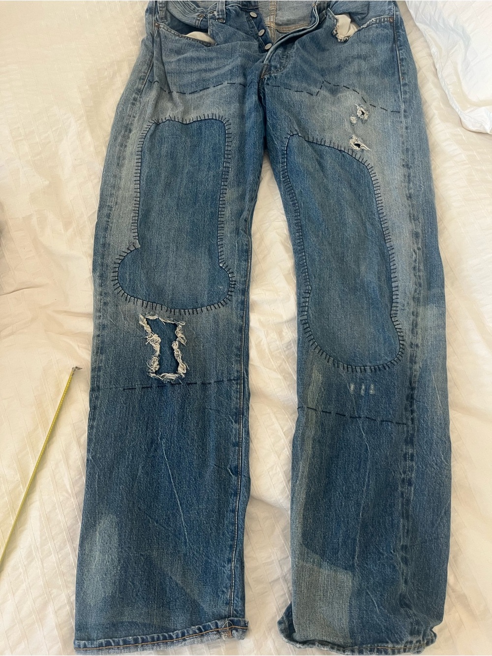 Levi's light blue denim patchwork jeans with leather patch